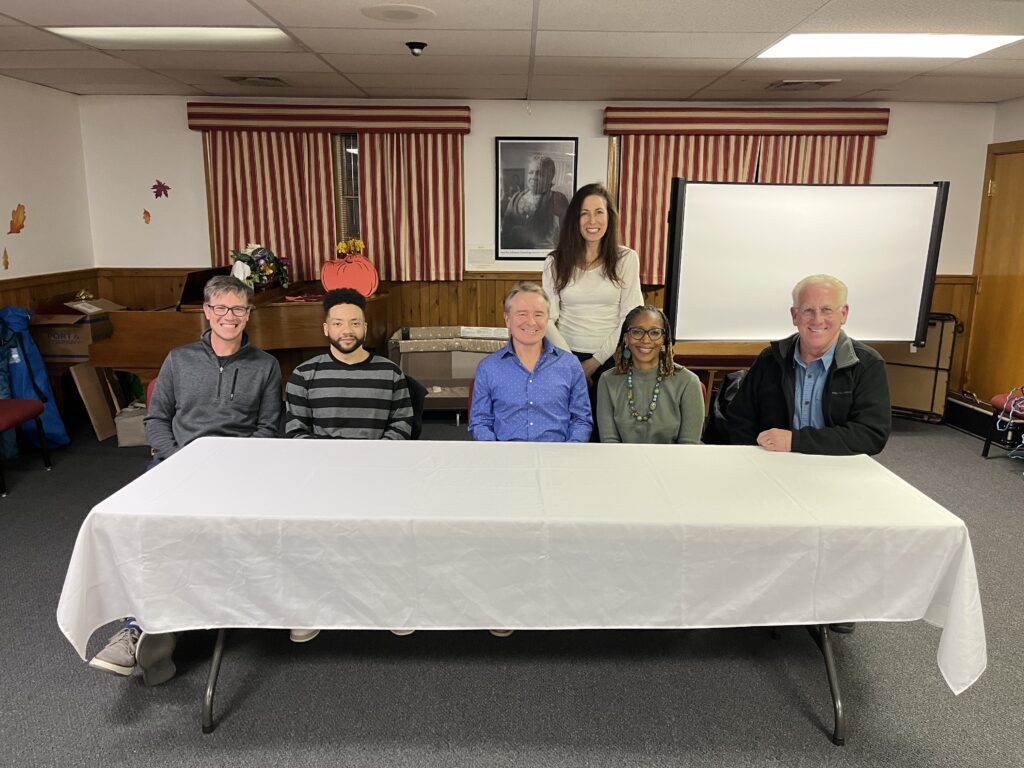 Panelists sitting at a table
